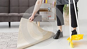 close up man brooming floor. High quality photo