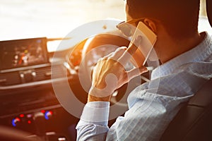 Close-up of man calling while driving