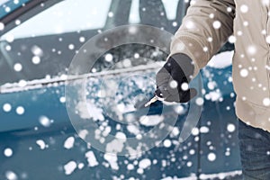 Close up of man with car key outdoors