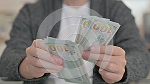 Close up of Man Counting Money