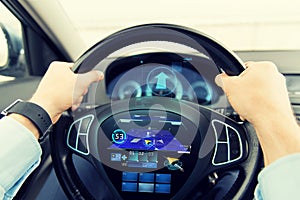 Close up of man driving car with gps navigator