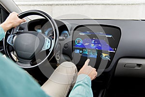 Close up of man driving car with gps navigator map