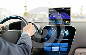 Close up of man driving car with navigation system