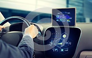 Close up of man driving car with navigation system