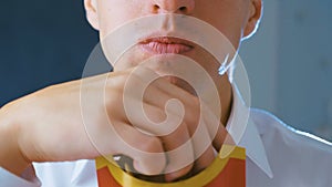 Close-up Man eating French fries, harmful and tasty fast food