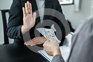 Close up of man employee offering bribe money to businessman to signing the contract to joint engage