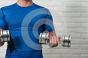 Close-Up Man Exercise Biceps With Dumbbells