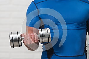 Close-Up Man Exercise Biceps With Dumbbells