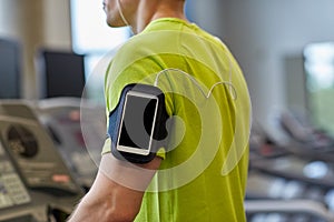 Close up of man exercising on treadmill in gym