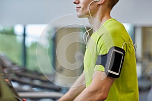 Close up of man exercising on treadmill in gym