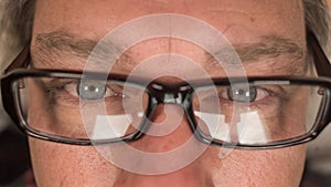 Close up of a man eyes wearing glasses