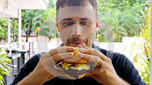 Close-up of man with funny face, licking his lips preparing to eat delicious