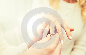 Close up of man giving diamond ring to woman