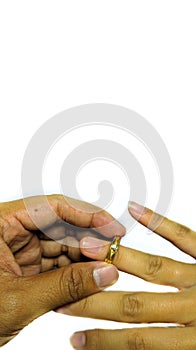 Close up of man giving golden ring to woman