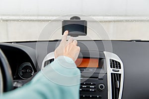 Close up of man with gps navigator driving car