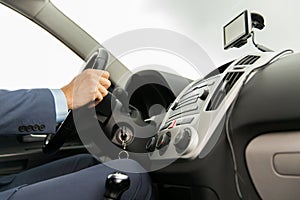 Close up of man with gps navigator driving car