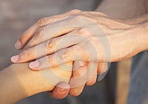 Close up of Man hand as Lending a helping hand as trust together with compassion concept