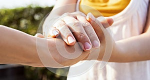 Close up of Man hand as Lending a helping hand as trust together with compassion concept scene at park