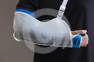 Close up man hand with bandage as arm injury concept