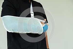 Close up man hand with blue bandage as arm injury concept