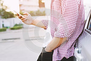 Close up of a man hand holding using mobile smart phone outdoor cell phone