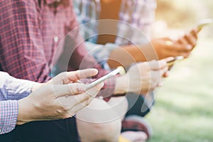 Close up of a man hand holding using mobile smart phone outdoor cell phone