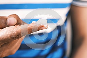 Close up of man hand using petroleum jelly