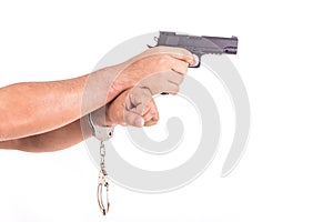 Close up man with handcuffs and gun on hands isolated on white