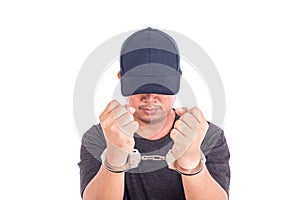 Close up man with handcuffs on hands isolated on white background