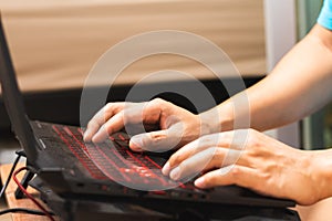 Close up man hands using lap top computer