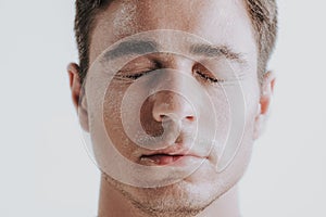 Close up of man having white drops after cosmetic procedure