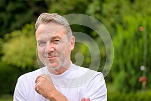 Close up of a man in his fifties with a mischievous smile