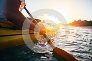 Close up of man holding kayak paddle