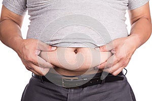 Close-up of man holding unhealthy big belly visceral subcutaneous fats photo