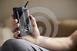 Close Up Of Man Holding Vapourizer