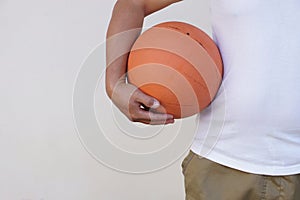 Close up man holds orange basketball. Concept, Sport equipment.