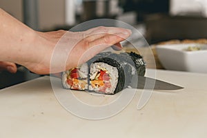 Close up of man japanese restaurant chef cooking sushi in the kitchen