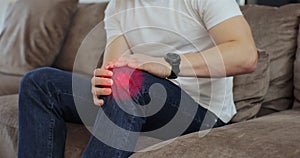 Close up of man knee with red pulsating sore zone joint spasm at home. 3d animation. People health care problem.