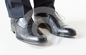 Close up of man legs in elegant shoes with laces