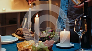 Close up of man lighting the candle