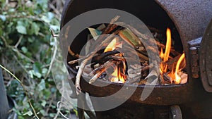 Close up a man lighting a fire.