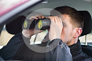 Close-up Of A Man Looking Through Binocular