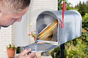 Man Opening The Mailbox photo