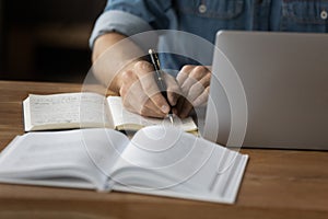 Close up of man make notes work online on computer