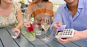 Close Up Of Man Making Contactless Payment At Outdoor Bar Or Restaurant Using Credit Or Debit Card