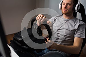 Close up of man playing car racing video game