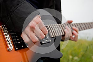 Close up of a man playing guitar