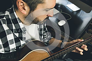 Close-up of a man playing Spanish guitar. Guitarist and musician