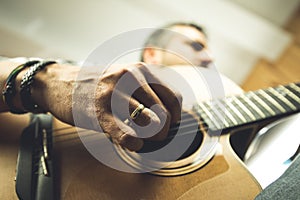 Close-up of a man playing Spanish guitar. Guitarist and musician