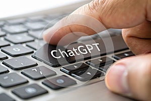 Close up of man pressing ChatGPT key on keyboard photo